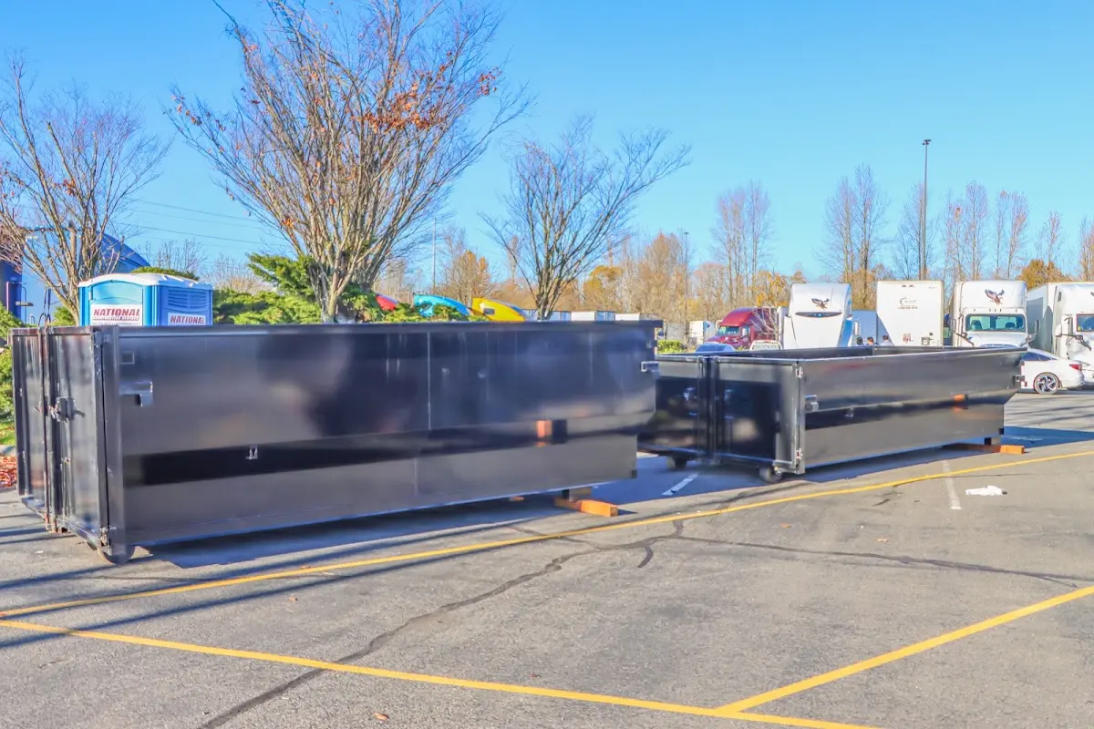 Professional dumpster rental service with roll-off container on residential driveway in Northbridge